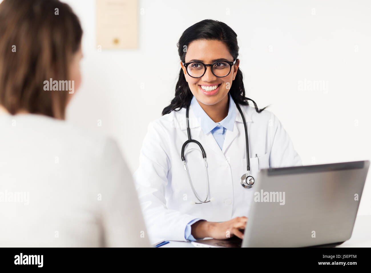 Smiling hindu woman doctor hi-res stock photography and images - Alamy