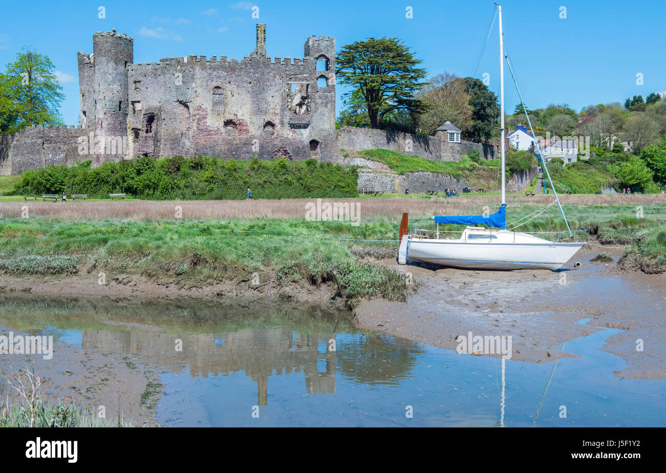 Laugharne Castle and Moored Boat, Carmarthenshire, south Wales Stock Photo