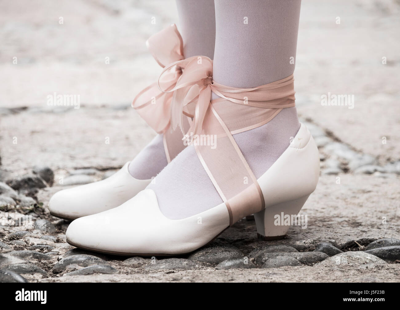 White shoes with ribbon and stockings. Stock Photo
