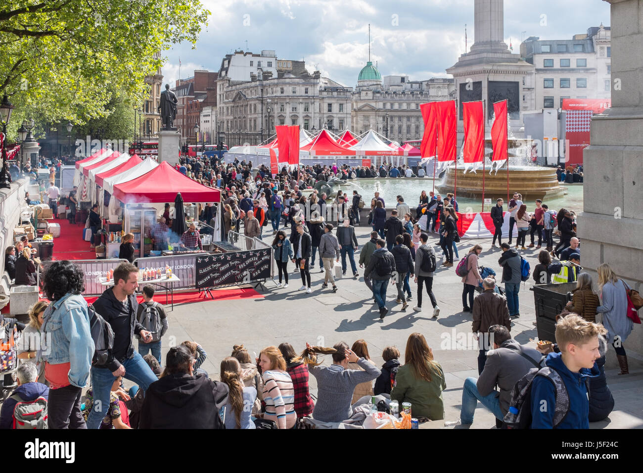 Tourists in London's Trafalgar Square Stock Photo