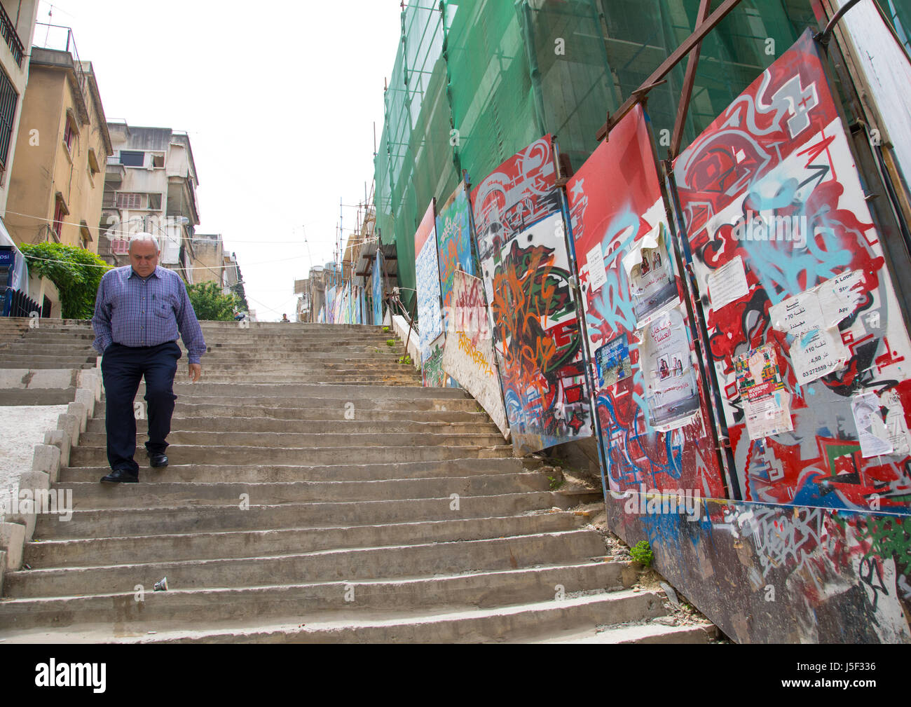 Old lebanese man going down stairs in mar mikhael, Beirut Governorate, Beirut, Lebanon Stock Photo