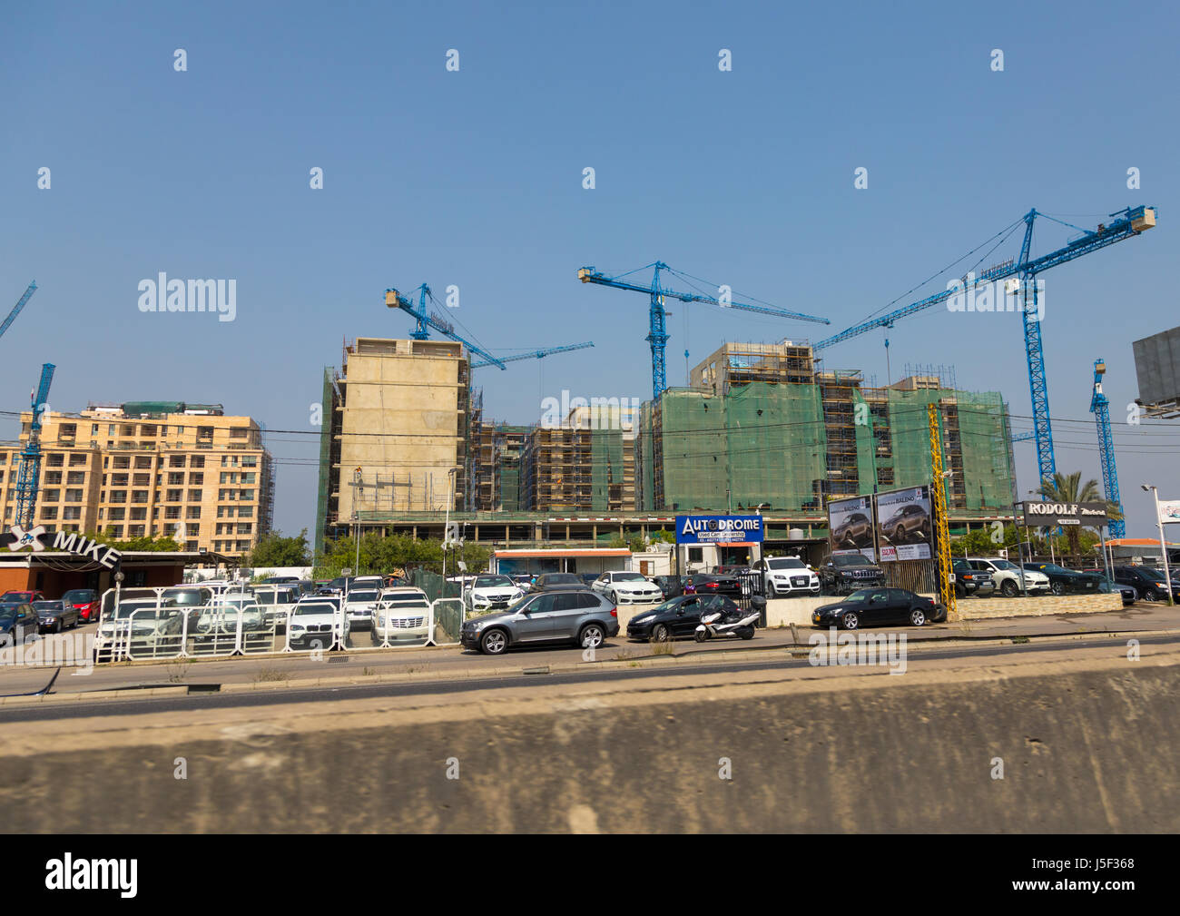 Cars shop in front of buildings under construction, Beirut Governorate