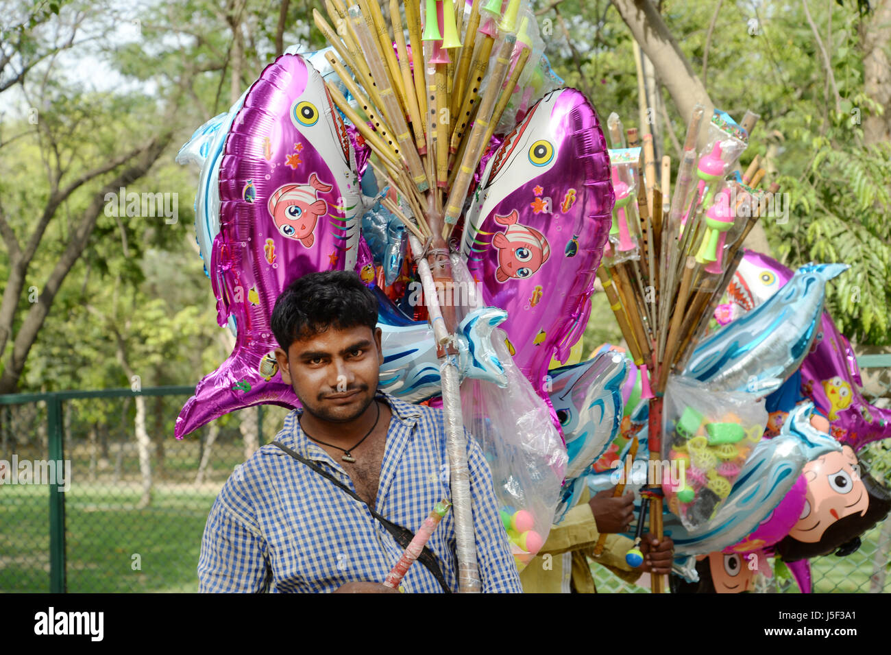 India, Delhi 2017. Deer Park. Itinerant novelty balloon seller Stock Photo