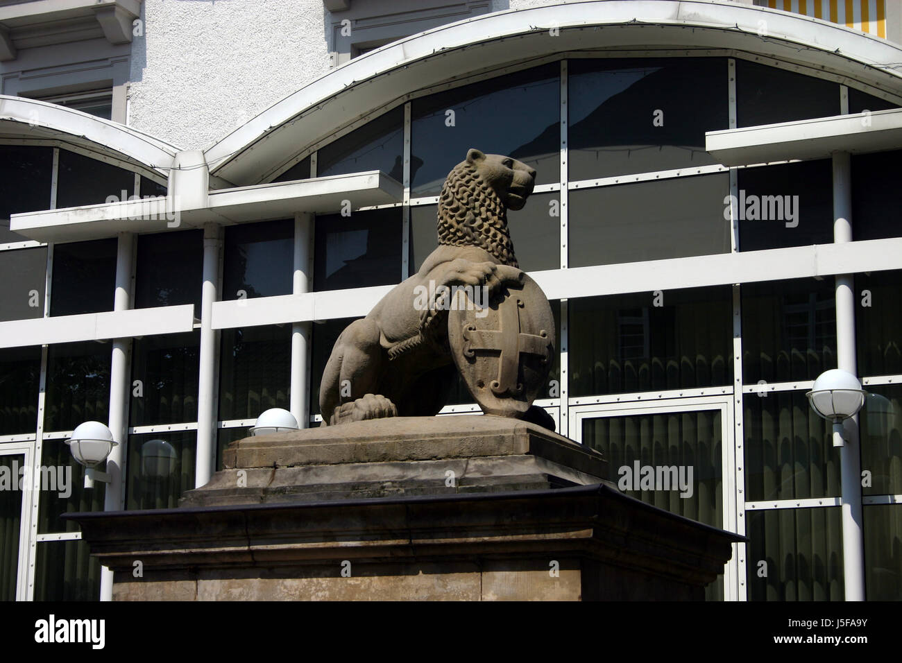 lion cat big cat feline predator goal passage gate archgway gantry entrance spa Stock Photo