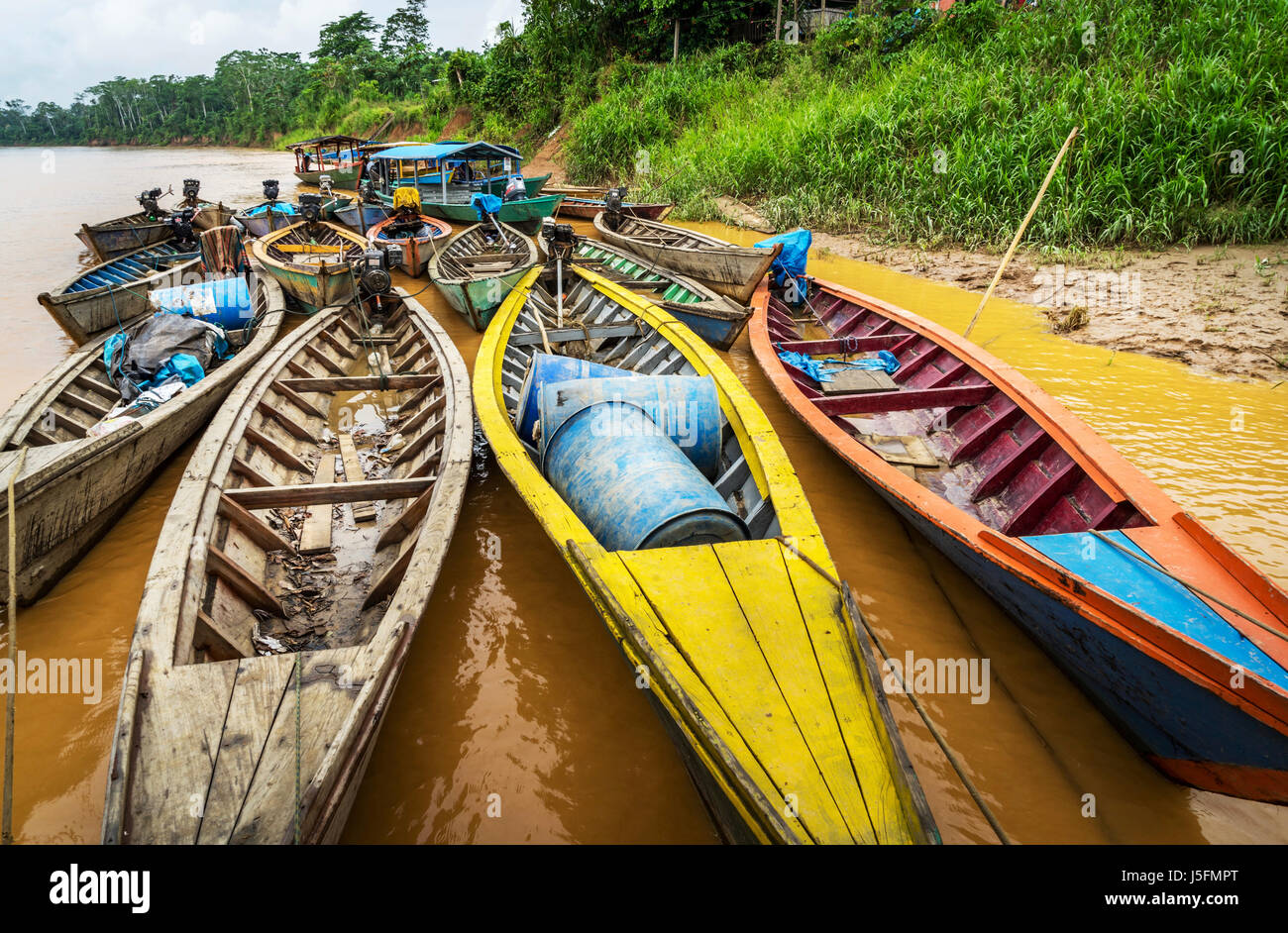 Close up of colorful boats on the amazon river in the jungle of Peru