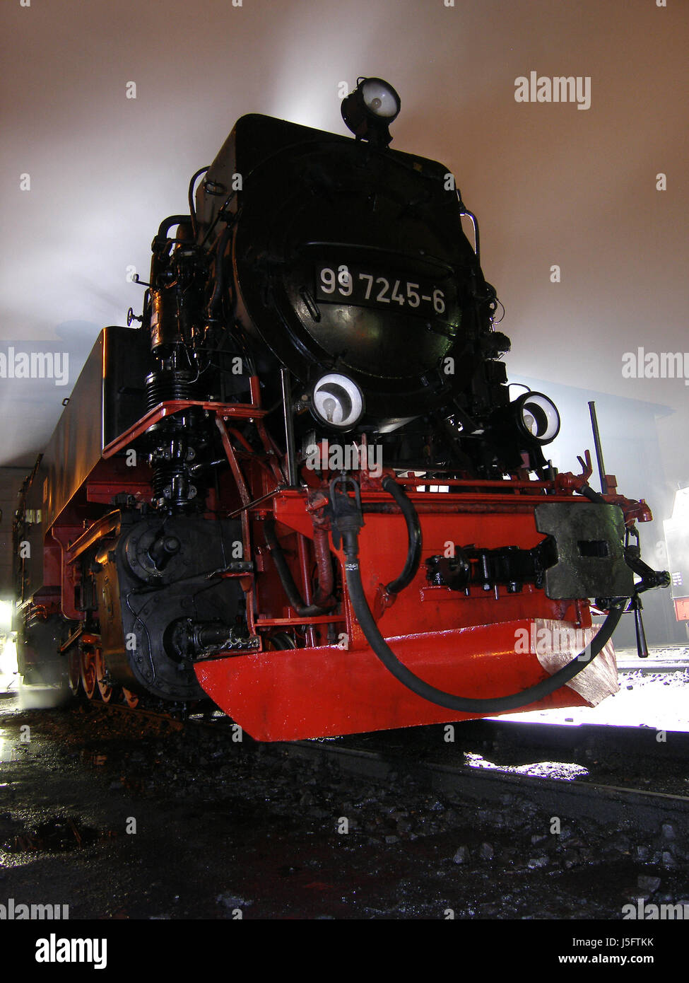 smoke smoking smokes fume railway locomotive train engine rolling stock vehicle Stock Photo