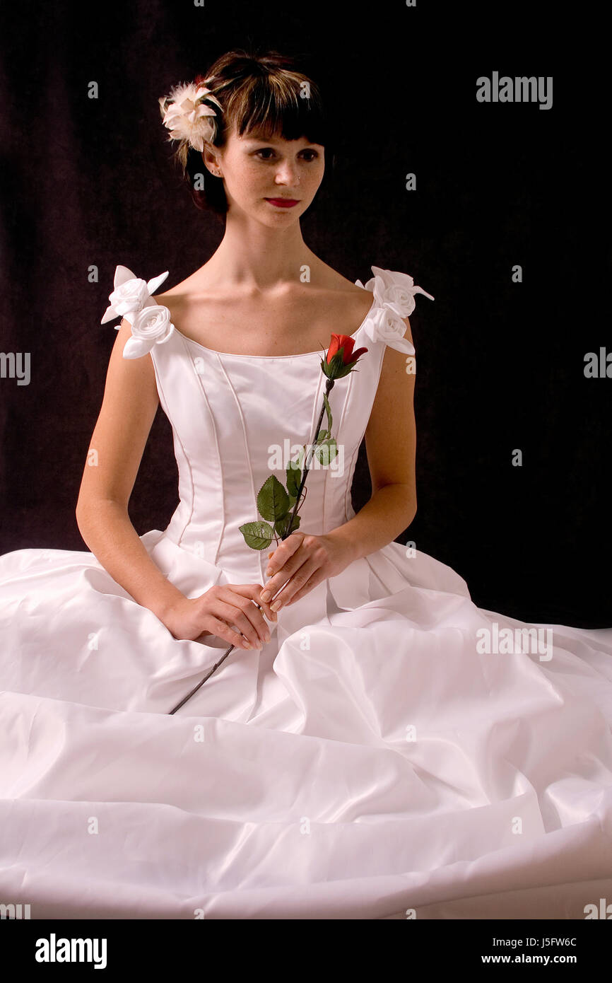 seated bride with rose Stock Photo