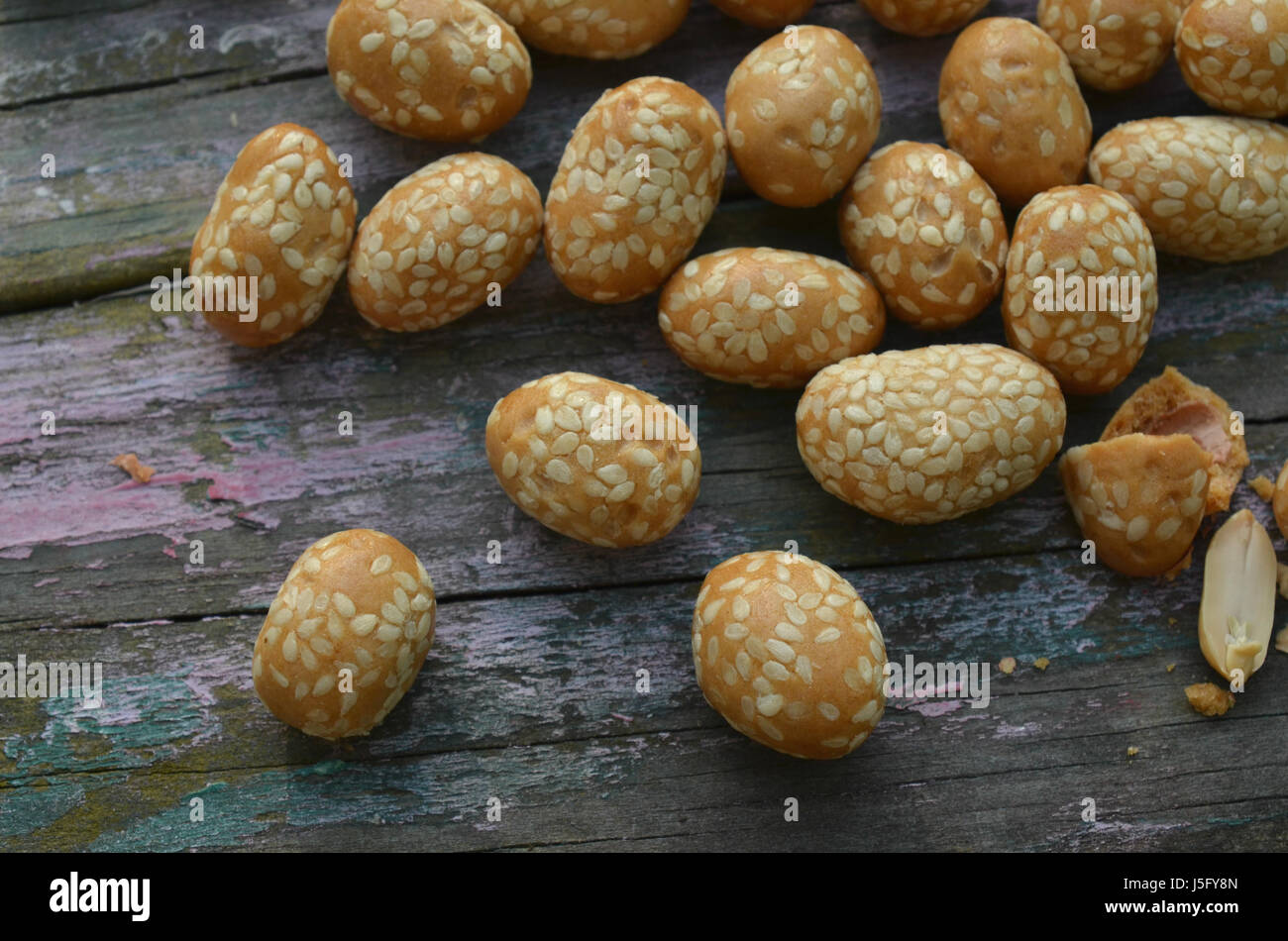 sesame seed covered candied peanuts Stock Photo Alamy