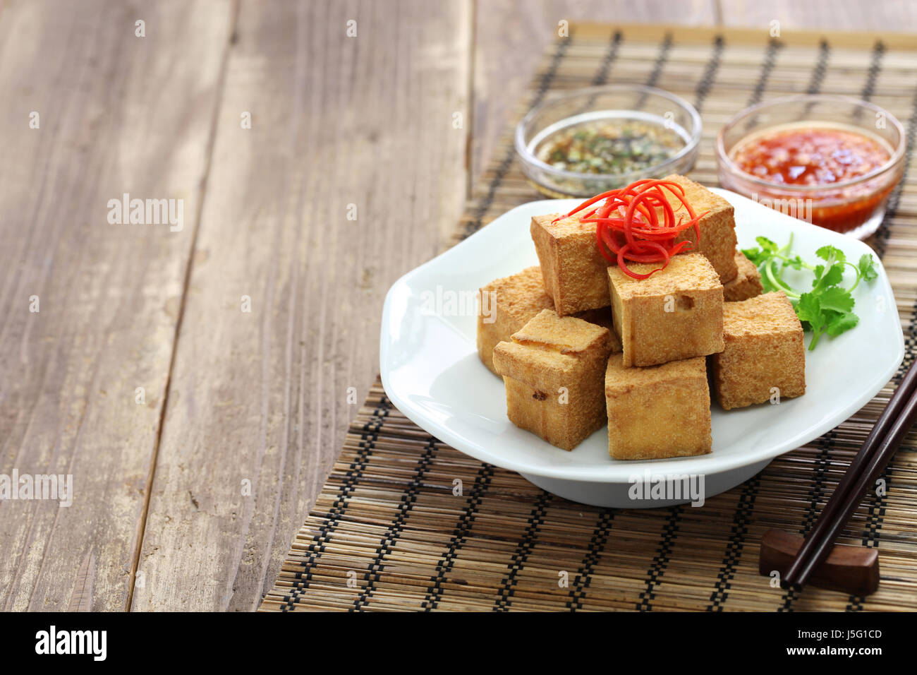 fried tofu with dipping sauce Stock Photo - Alamy