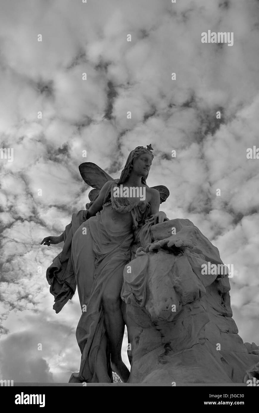 woman monument art stone statue black swarthy jetblack deep black wing Stock Photo