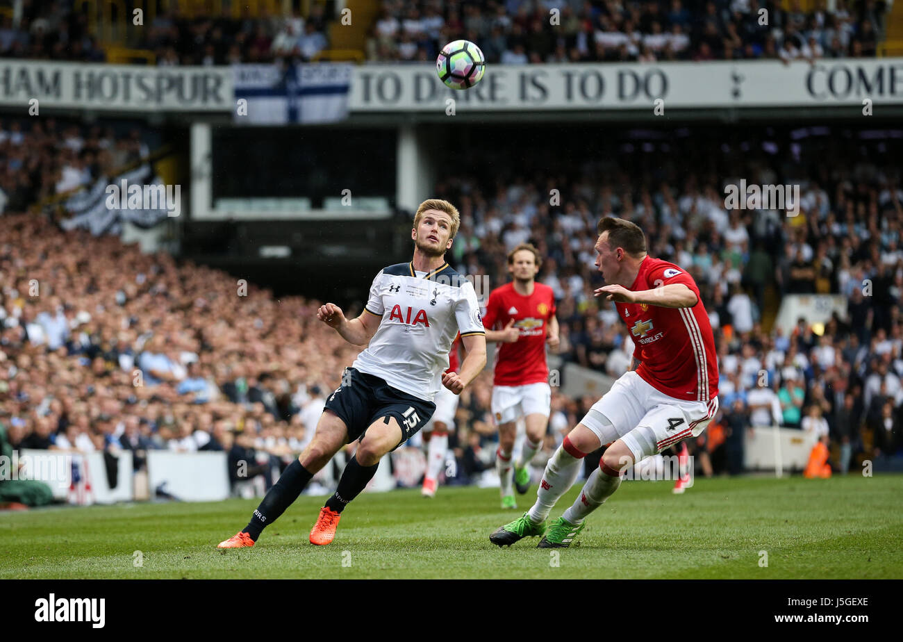 Eric Dier of Tottenham Hotspur lofts the ball over Phil Jones of Manchester United during the Premier League match between Tottenham Hotspur and Manchester United at White Hart Lane in London. 14 May 2017 EDITORIAL USE ONLY . No merchandising. For Football images FA and Premier League restrictions apply inc. no internet/mobile usage without FAPL license - for details contact Football Dataco ARRON GENT/TELEPHOTO IMAGES Stock Photo
