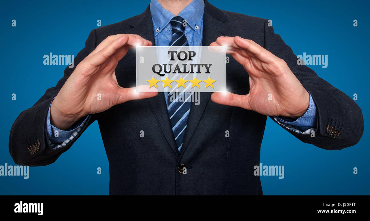 TOP Quality with five stars - Businessman with sign - Blue - Stock Photo Stock Photo