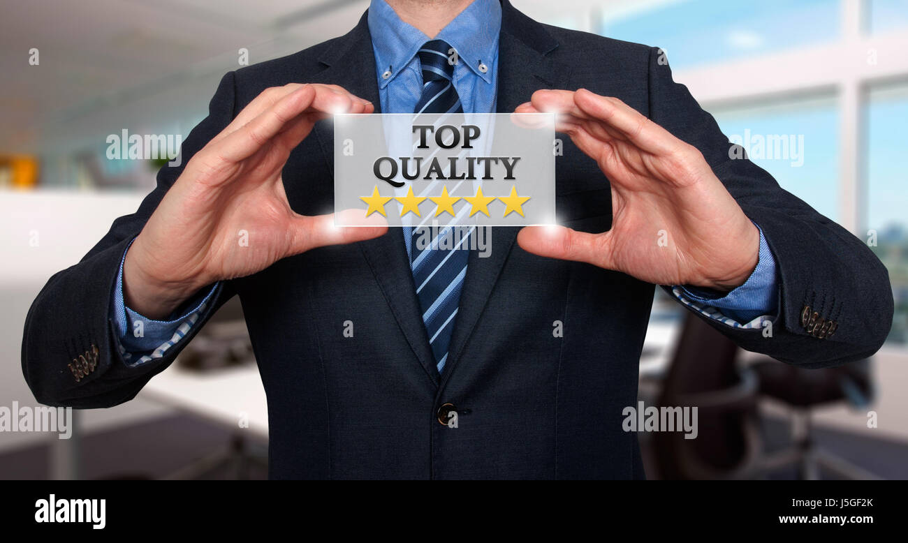 TOP Quality with five stars - Businessman with sign - Office - Stock Photo Stock Photo