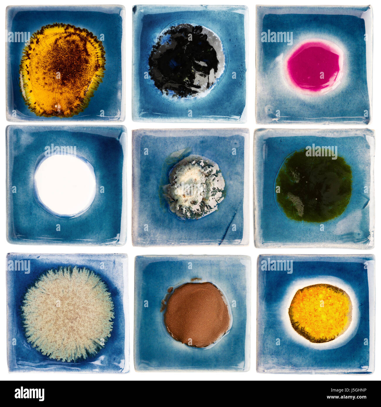 Collection of blue handmade glazed ceramic tiles with other color dots