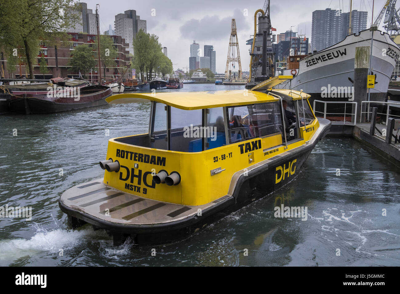 Rotterdam water taxi arriving at Maritime Museum Harbour, Leuvehaven, Rotterdam, The Netherlands. Stock Photo