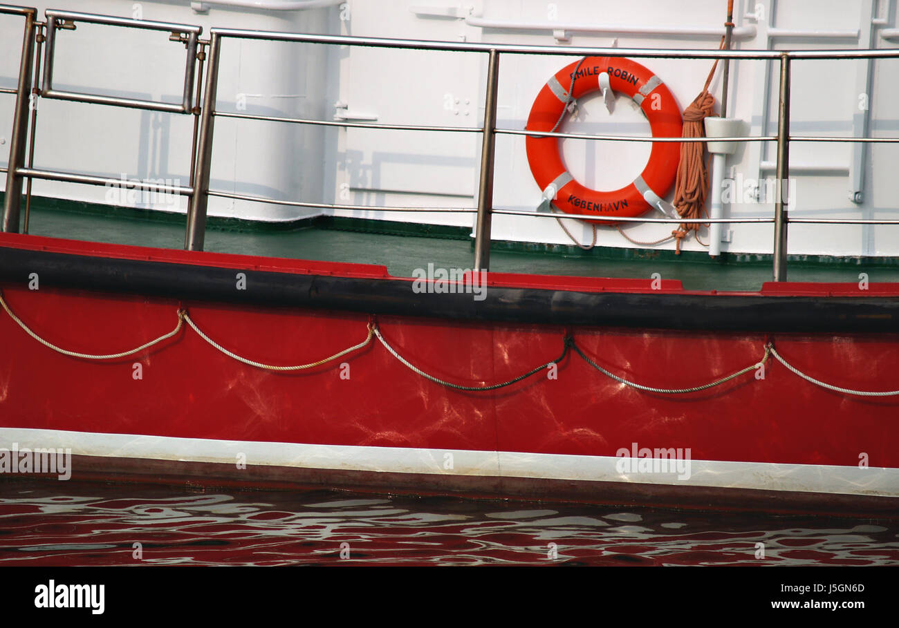 waters seafaring rescue lifebelt salt water sea ocean water red rowing boat Stock Photo