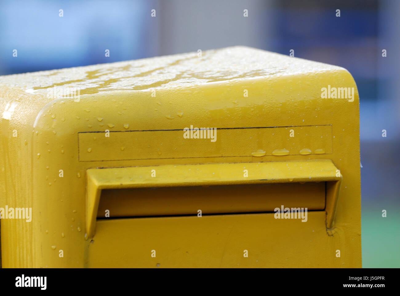 mailbox slot mailboxes slits yellow postksten posteinwurf einwurfschlitz Stock Photo