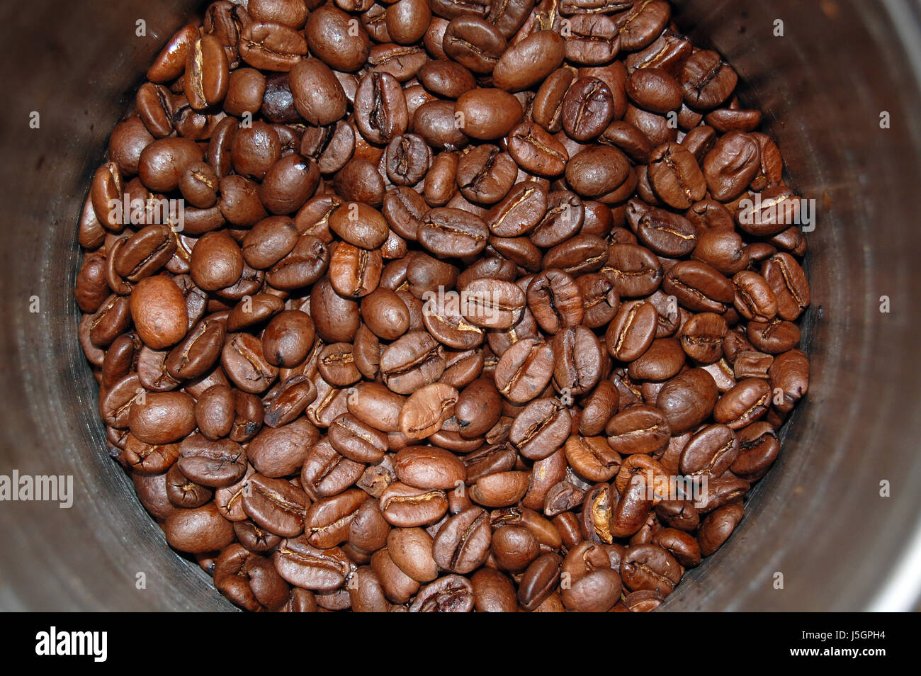 cafe black swarthy jetblack deep black beans tin espresso coffee caffeine rust Stock Photo