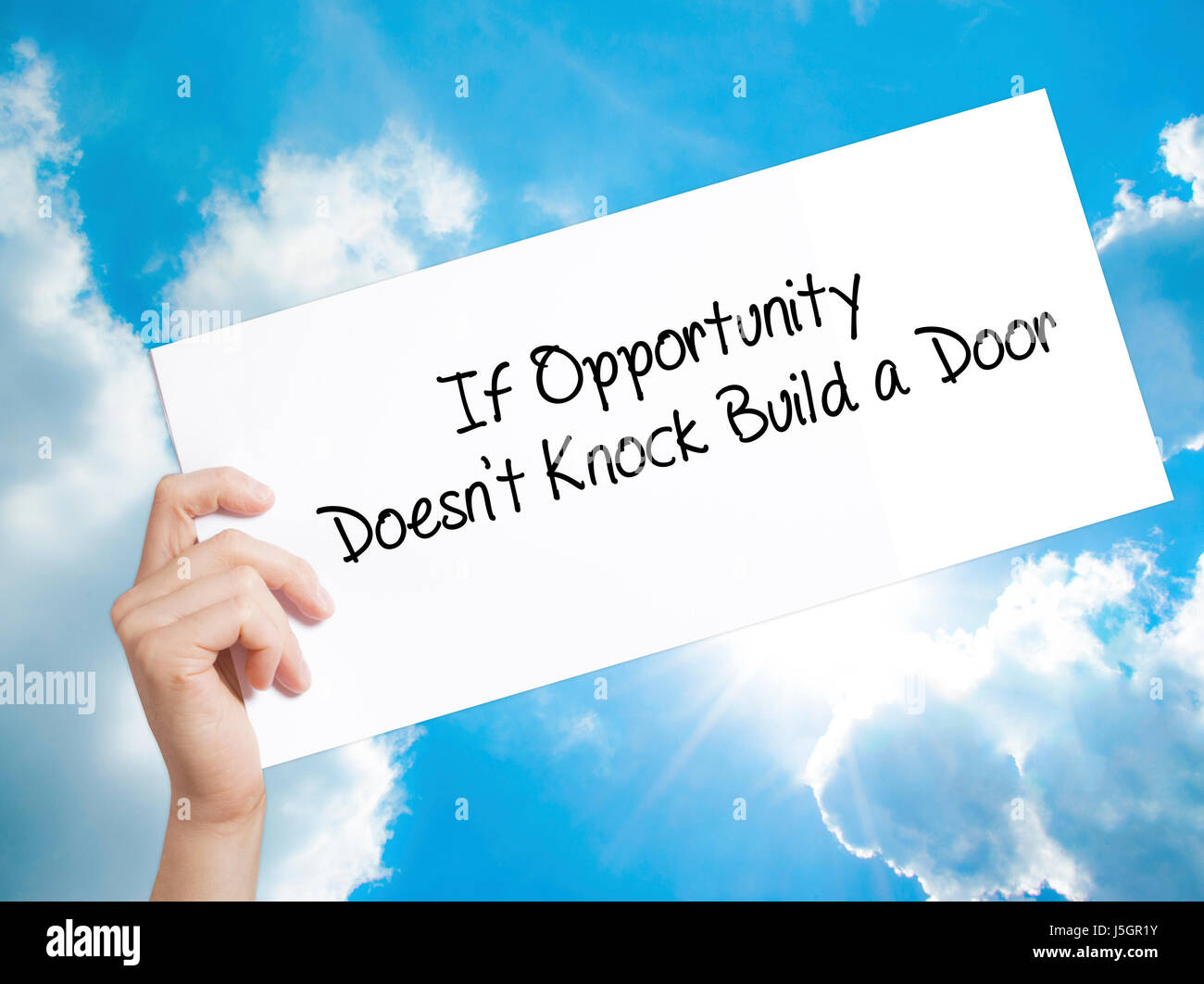 If Opportunity Doesn T Knock Build A Door Sign On White Paper Man Hand Holding Paper With Text Isolated On Sky Background Business Concept Stock Stock Photo Alamy