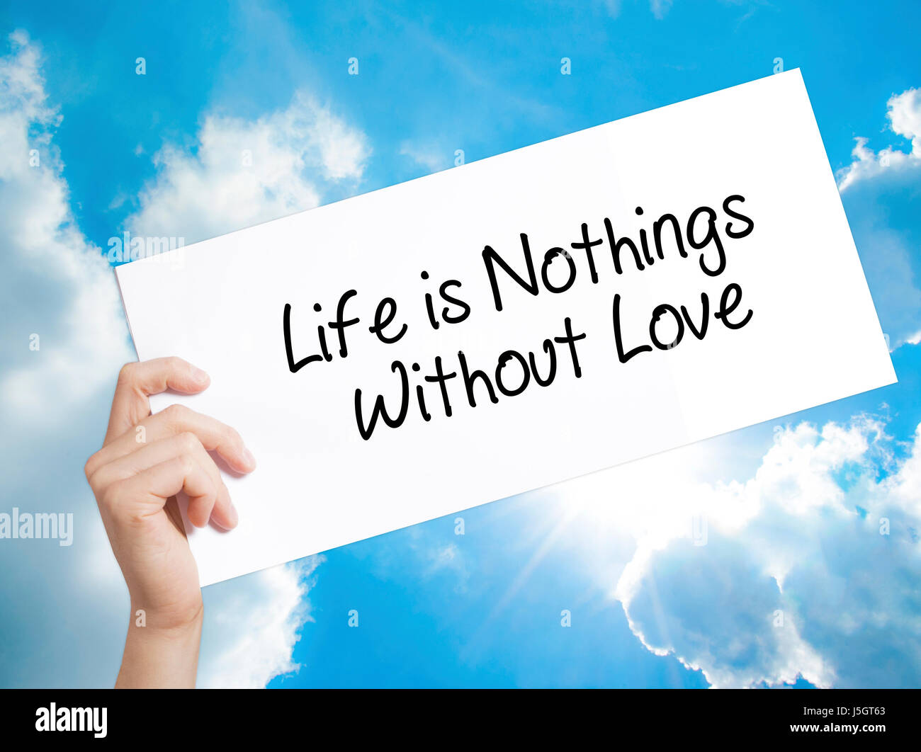 Life is Nothings Without Love Sign on white paper. Man Hand Holding ...