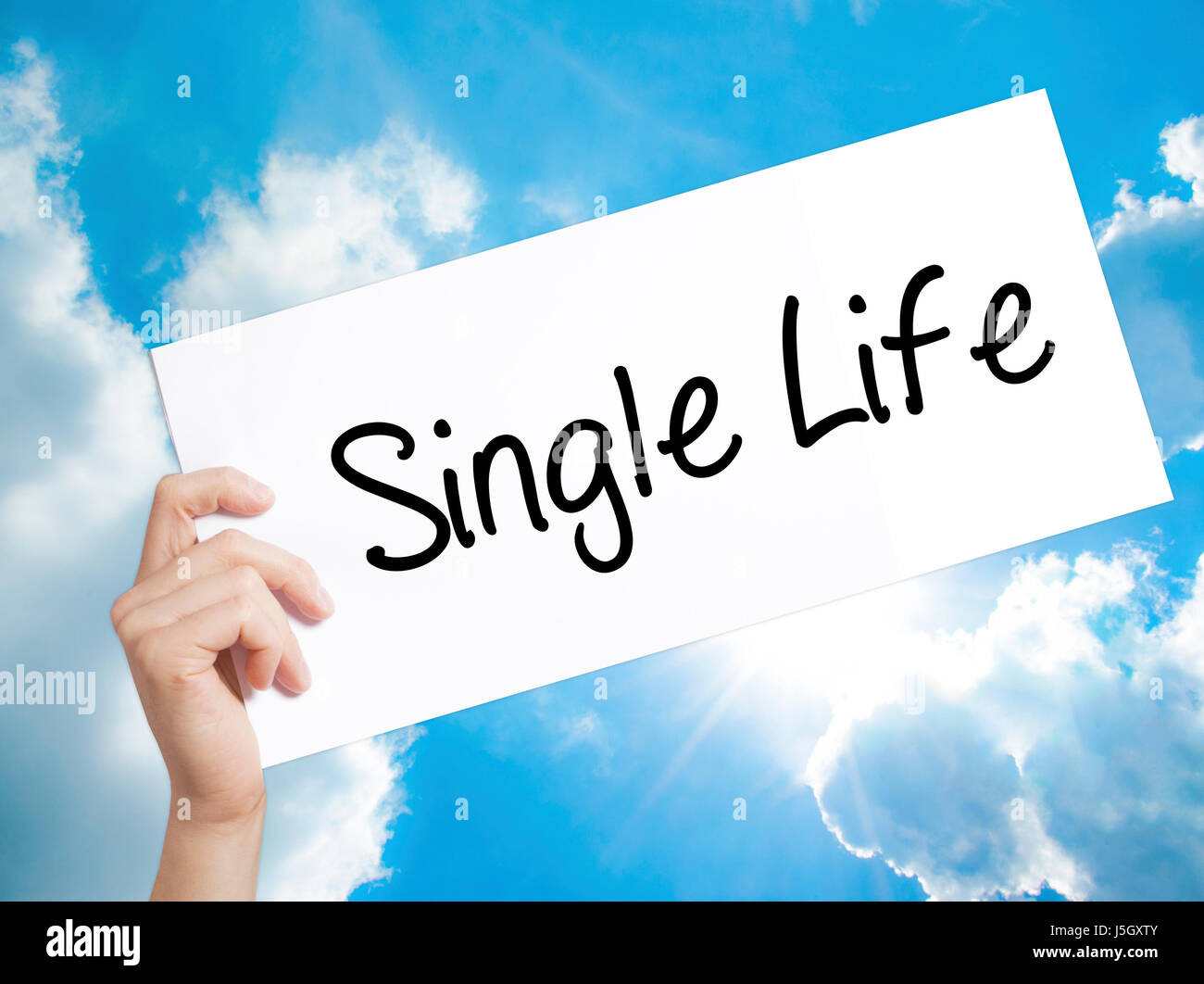 Single Life Sign on white paper. Man Hand Holding Paper with text. Isolated  on sky background. Business concept. Stock Photo Stock Photo - Alamy