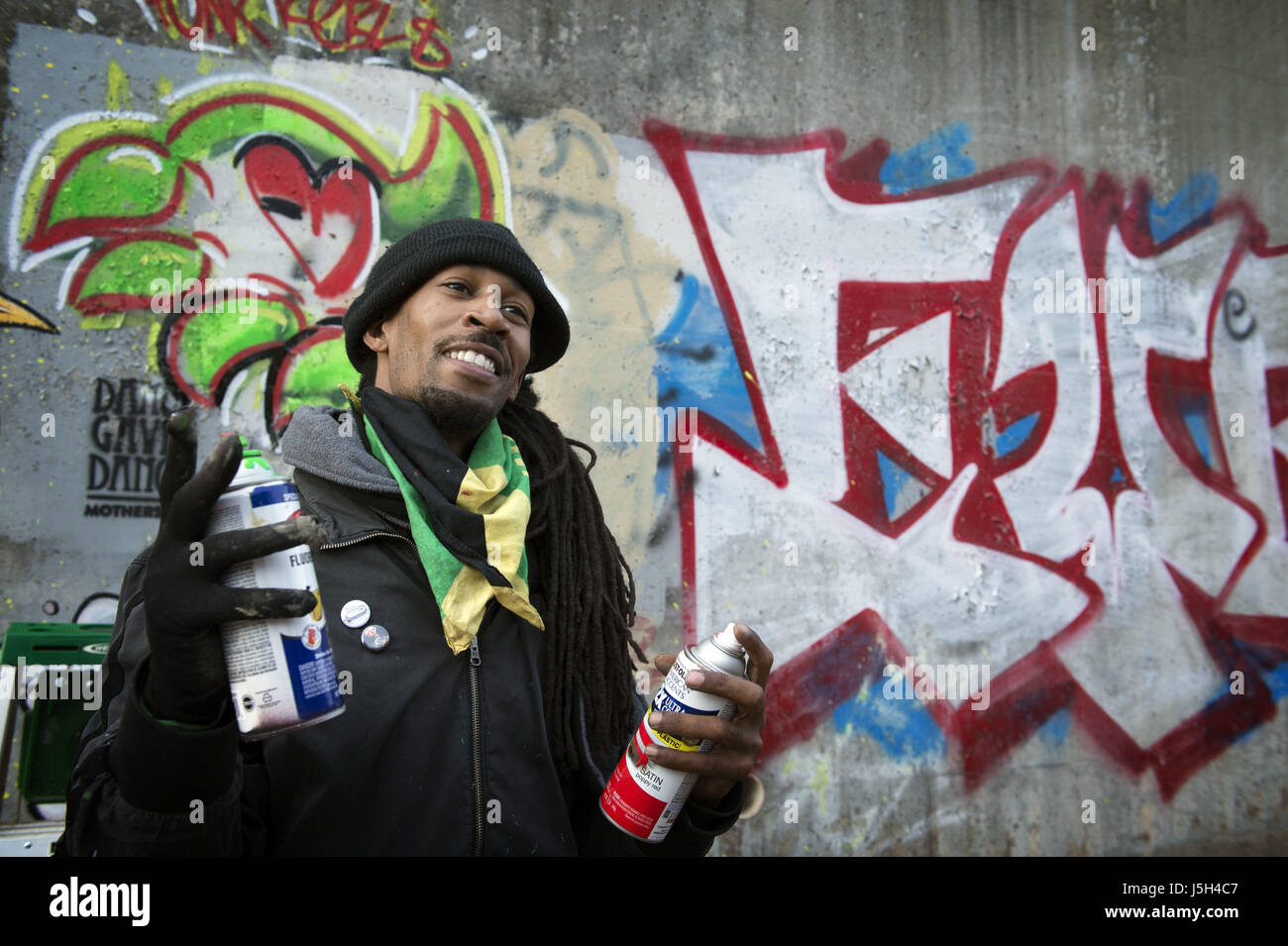 January 27, 2017 - Atlanta, GA - An urban artist who uses the name 'Dap' tags a large retaining wall with his creative graffiti in an industrial area of Atlanta, using nothing but cans of spray paint. (Credit Image: © Robin Rayne Nelson via ZUMA Wire) Stock Photo