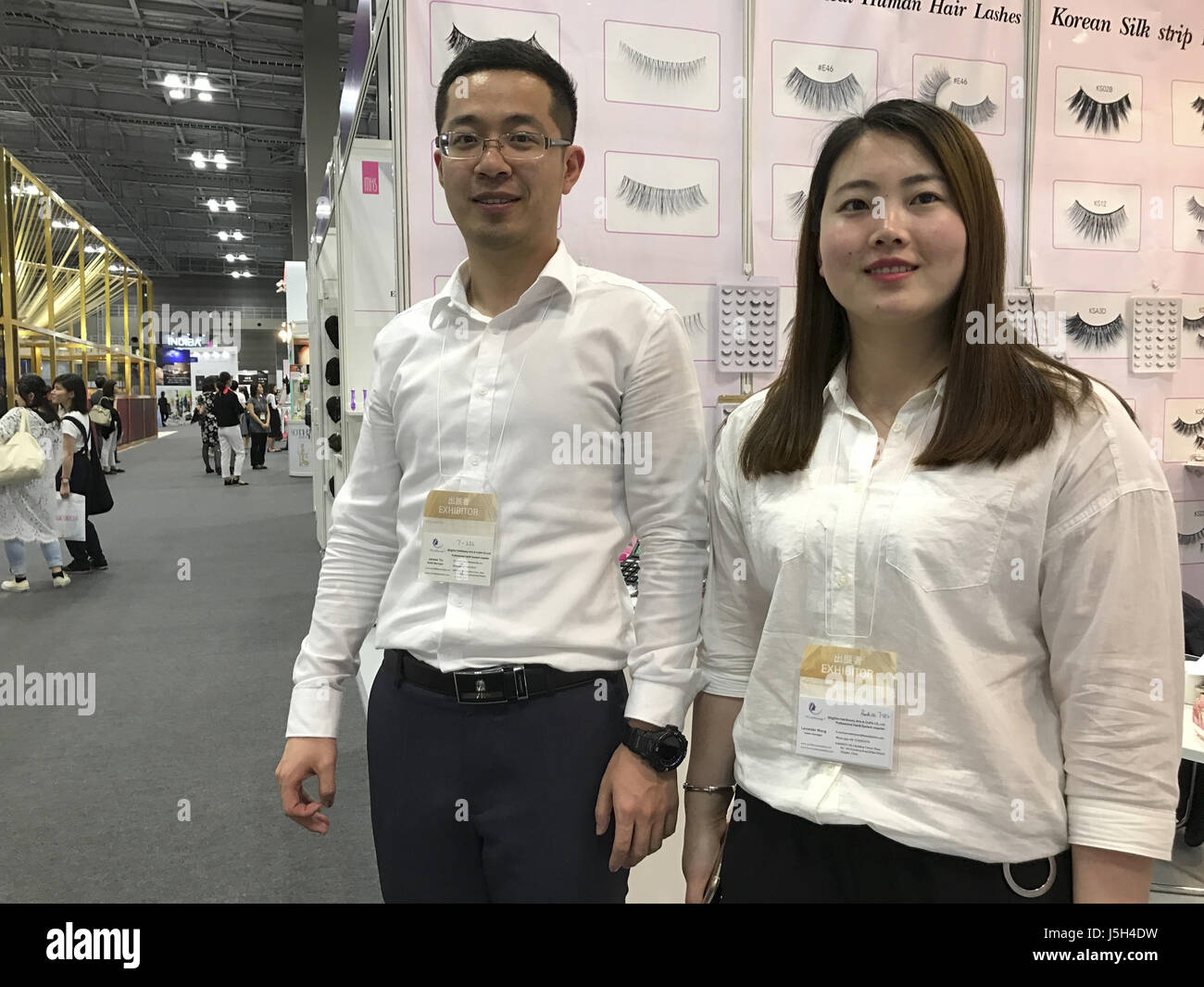 May 16, 2017 - Tokyo, Japan - (right) Lavender Wong and James Yu of China stand at Qingdao Hairbeauty Arts and Crafts Co., Ltd. booth during the Tokyo Nail Forum 2017 on Tuesday May 16, 2017. Photo by: Ramiro Agustin Vargas Tabares (Credit Image: © Ramiro Agustin Vargas Tabares via ZUMA Wire) Stock Photo