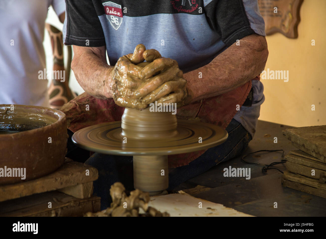 Potter working clay in Trinidad, Cuba Stock Photo