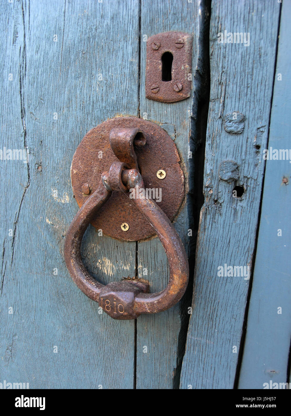 wood antique door iron rusty rusted knocker second-hand keyhole old trffner Stock Photo