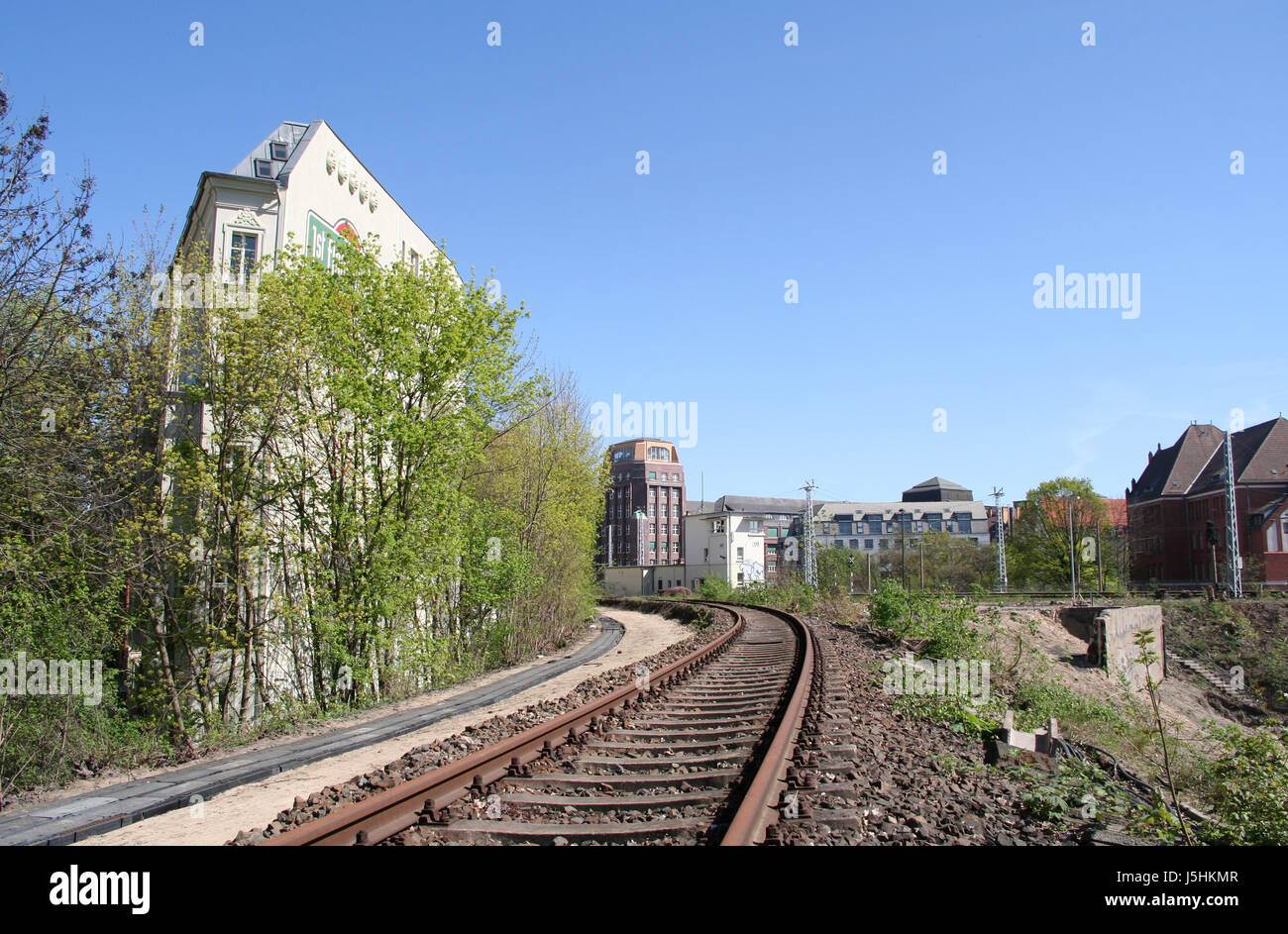 spring berlin inoperative bend bluer railway rails rope firmament sky building Stock Photo