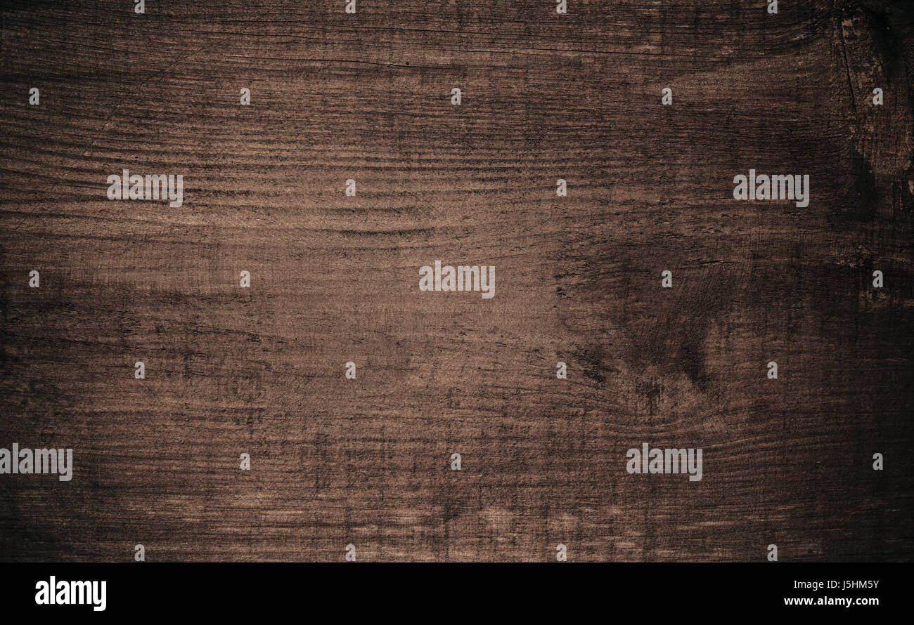 Brown dark scratched wooden cutting, chopping board. Wood texture. Stock Photo