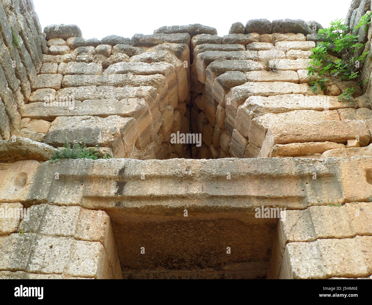 Relieving Triangle above the Doorway of the Beehive Tomb Treasury of Atreus Archaeological Site of Mycenae in Greece Stock Photo