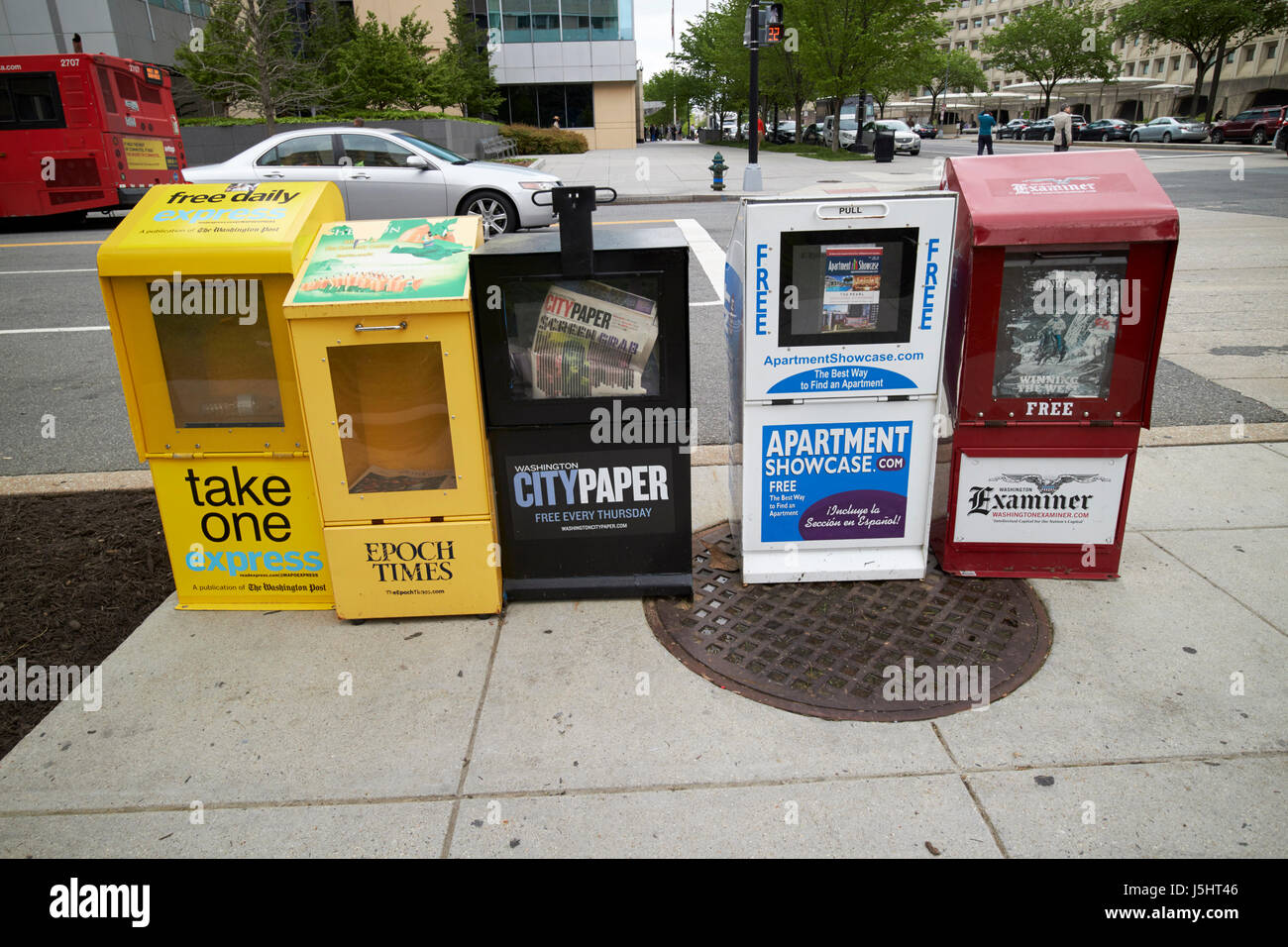 free newspaper stands on sidewalk Washington DC USA Stock Photo