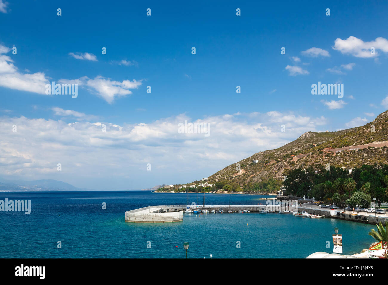Long stone pier into the sea, Loutraki, Greece Stock Photo - Alamy