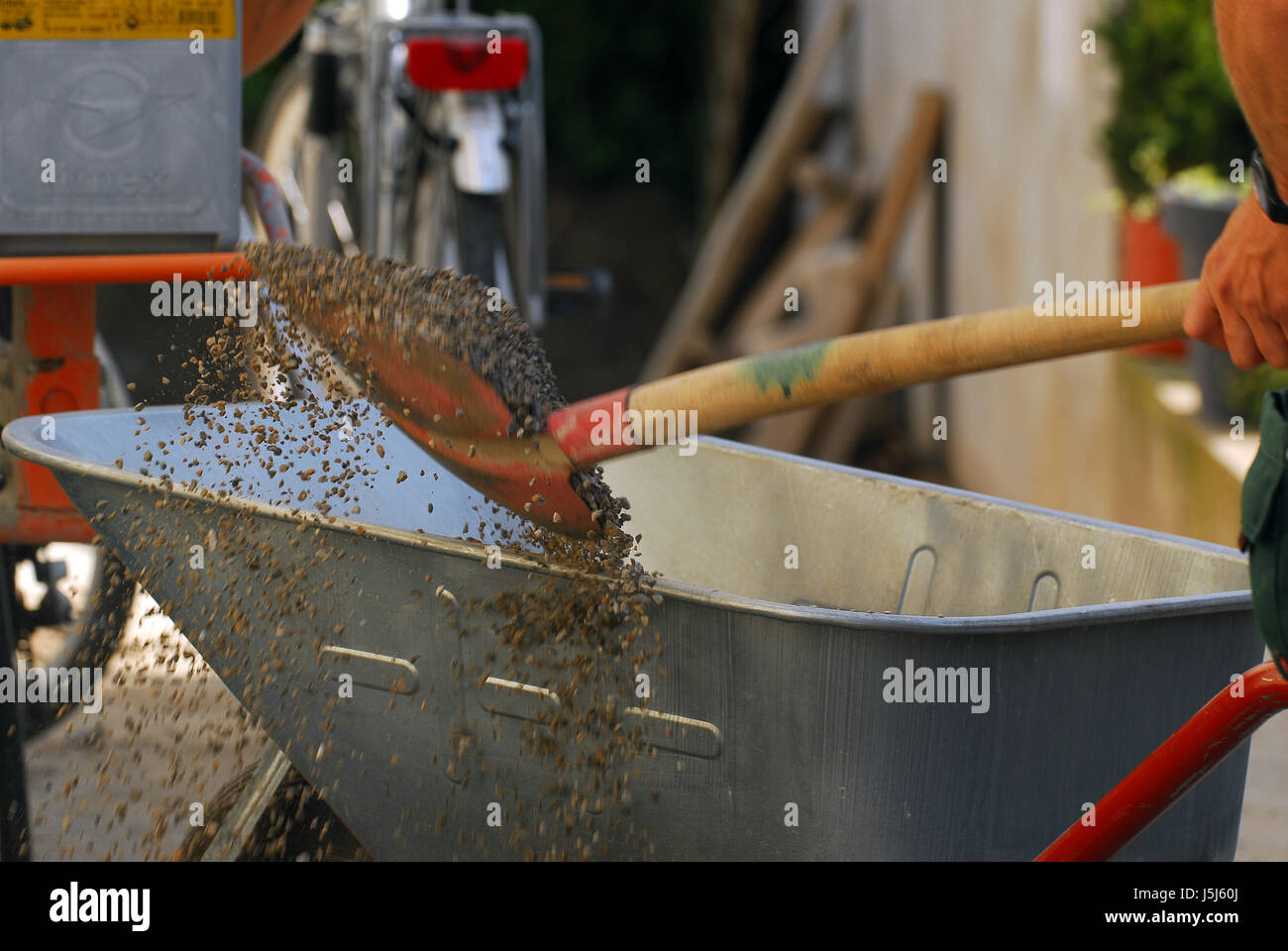wheelbarrow shovel handicraft construction site baustellen baumassnahme Stock Photo