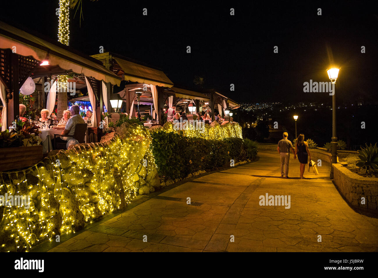 A charming, busy restaurant at the beach in Playa del Duque, Costa Adeje, Tenerife, Spain Stock Photo