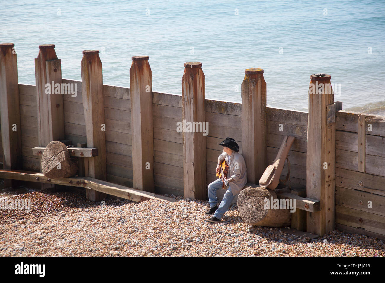 Cowboy on the beach Stock Photo