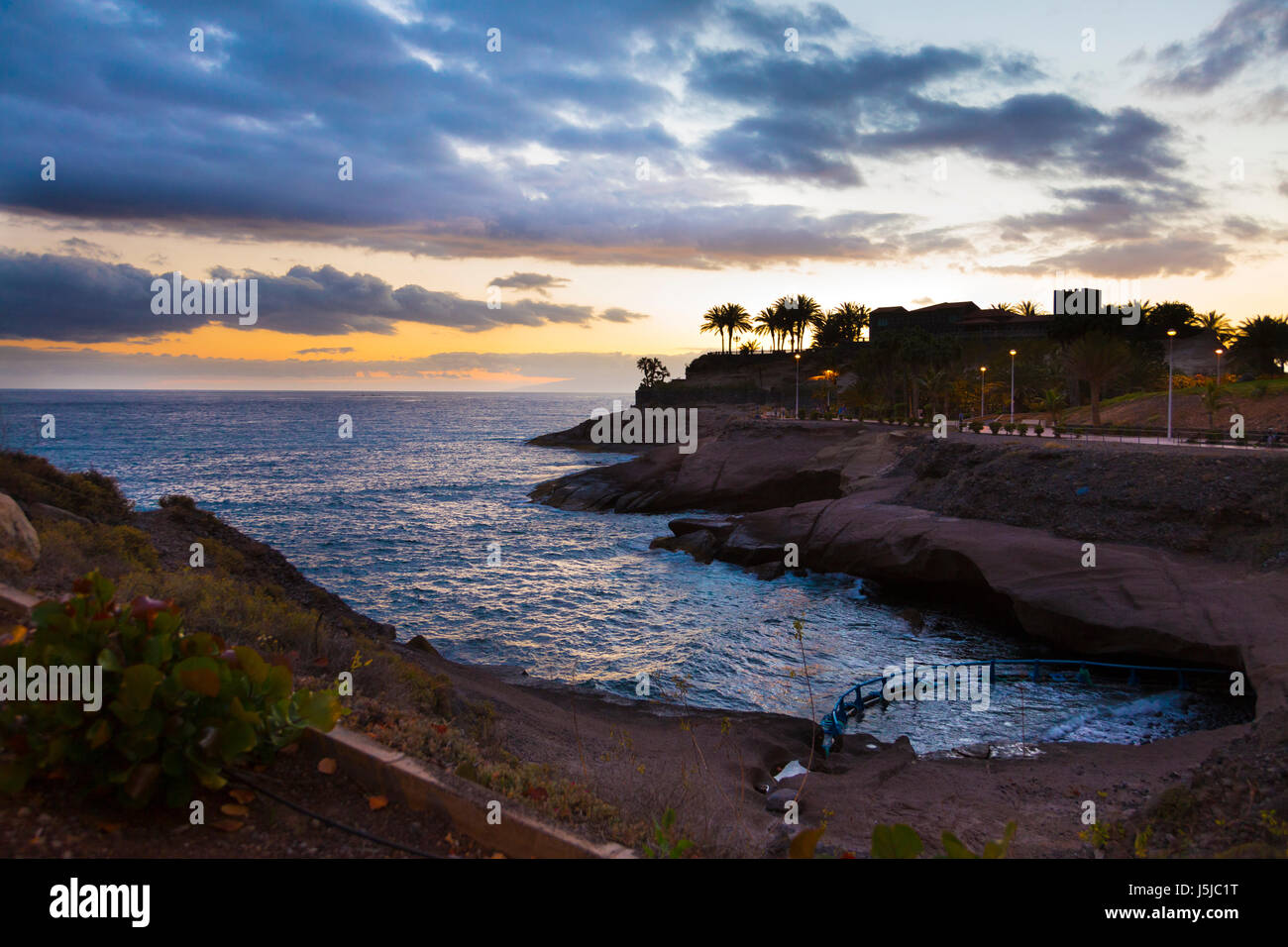 View of the Atlantic Ocean and the rocky coast of Costa Adeje, Tenerife, Spain Stock Photo