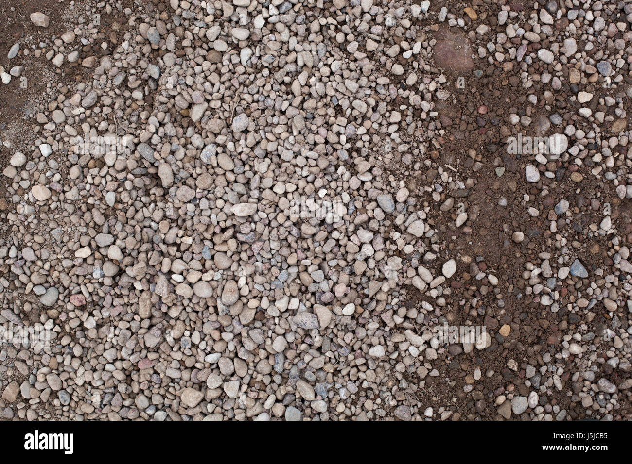 Little pebbles on the ground Stock Photo - Alamy