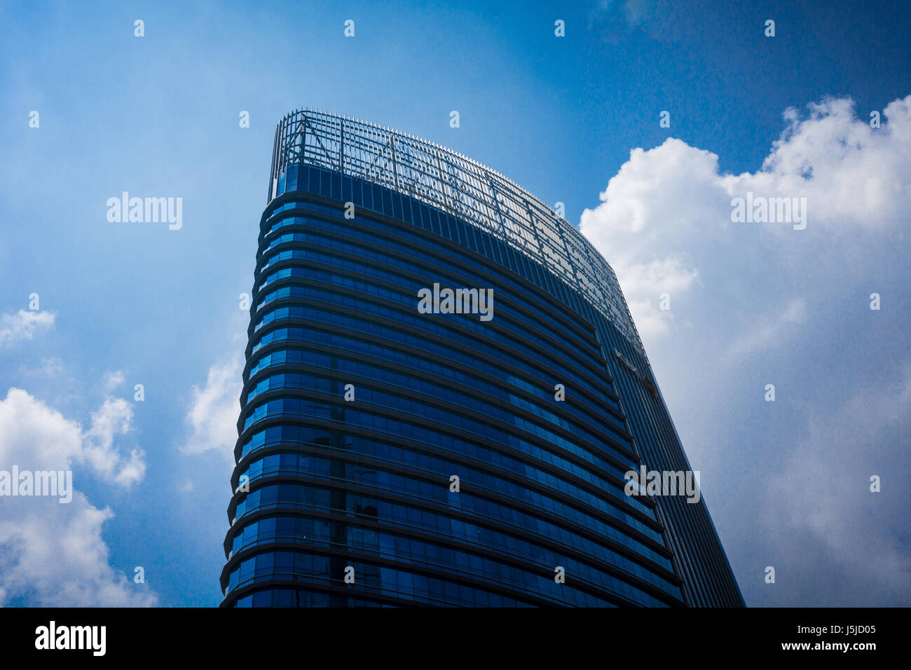 high building office with blue glass and blue sky Stock Photo - Alamy
