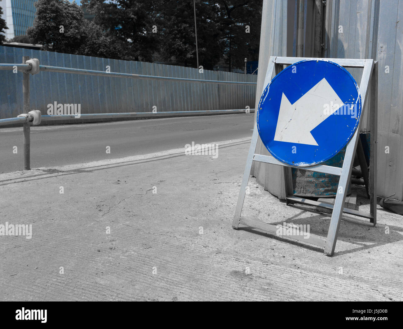 road sign arrow down with blue color Stock Photo - Alamy