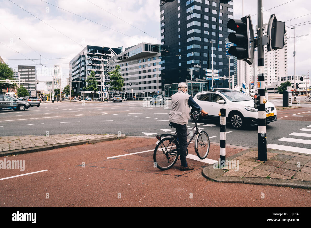 Rottedam, The Netherlands - August 6, 2016: Rotterdam cityscape and car traffic in a crossroads. Rotterdam is home to some world famous architecture f Stock Photo