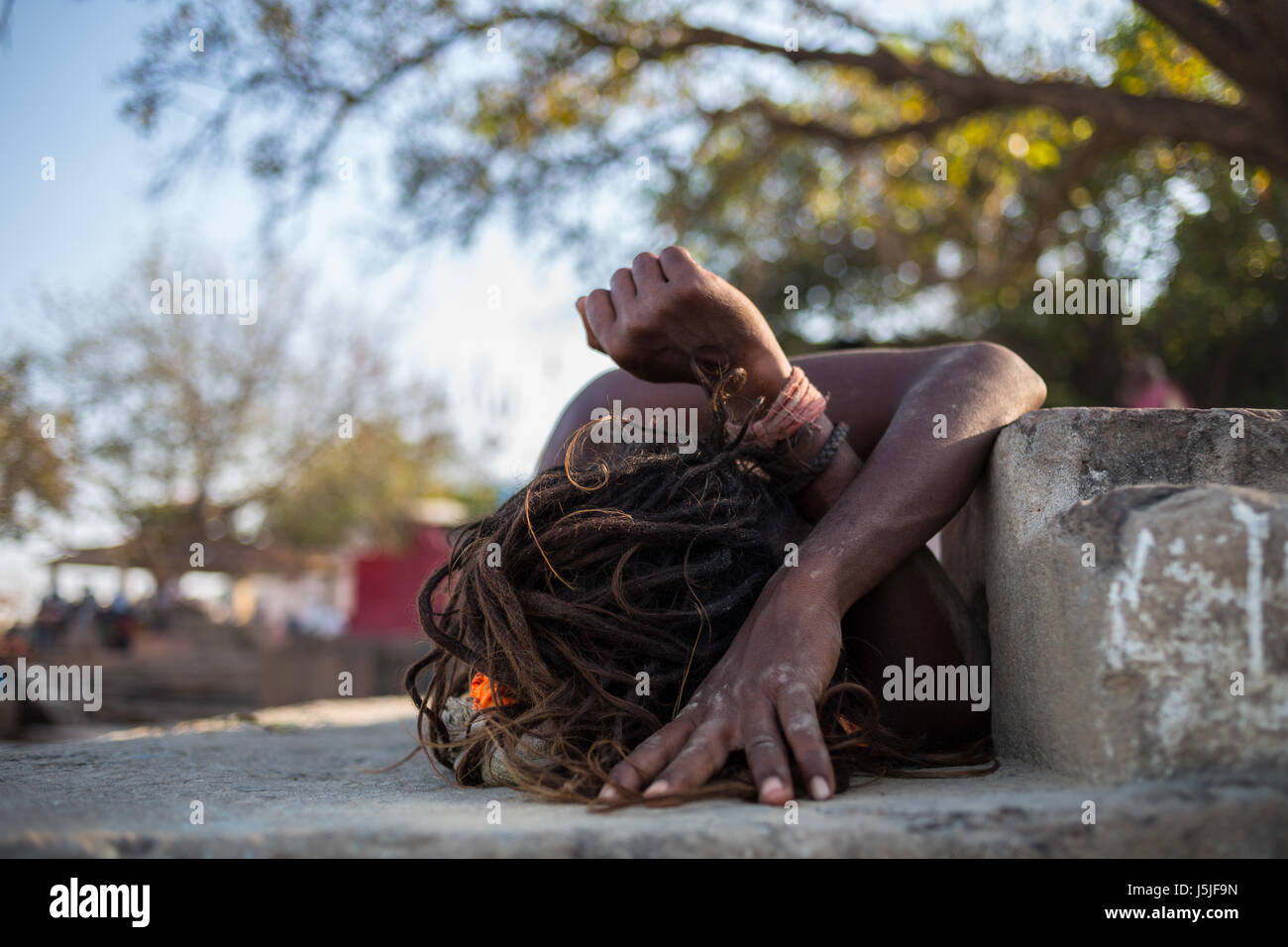 An Indian man taking a nap during the hot hours. Stock Photo