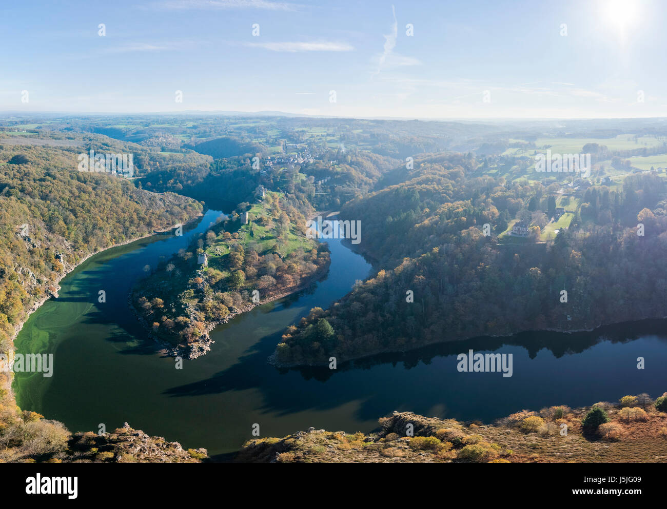 France, Creuse, Crozant, castle ruins, the loop of the Creuse and the junction with the Sedelle in autumn (aerial view) Stock Photo