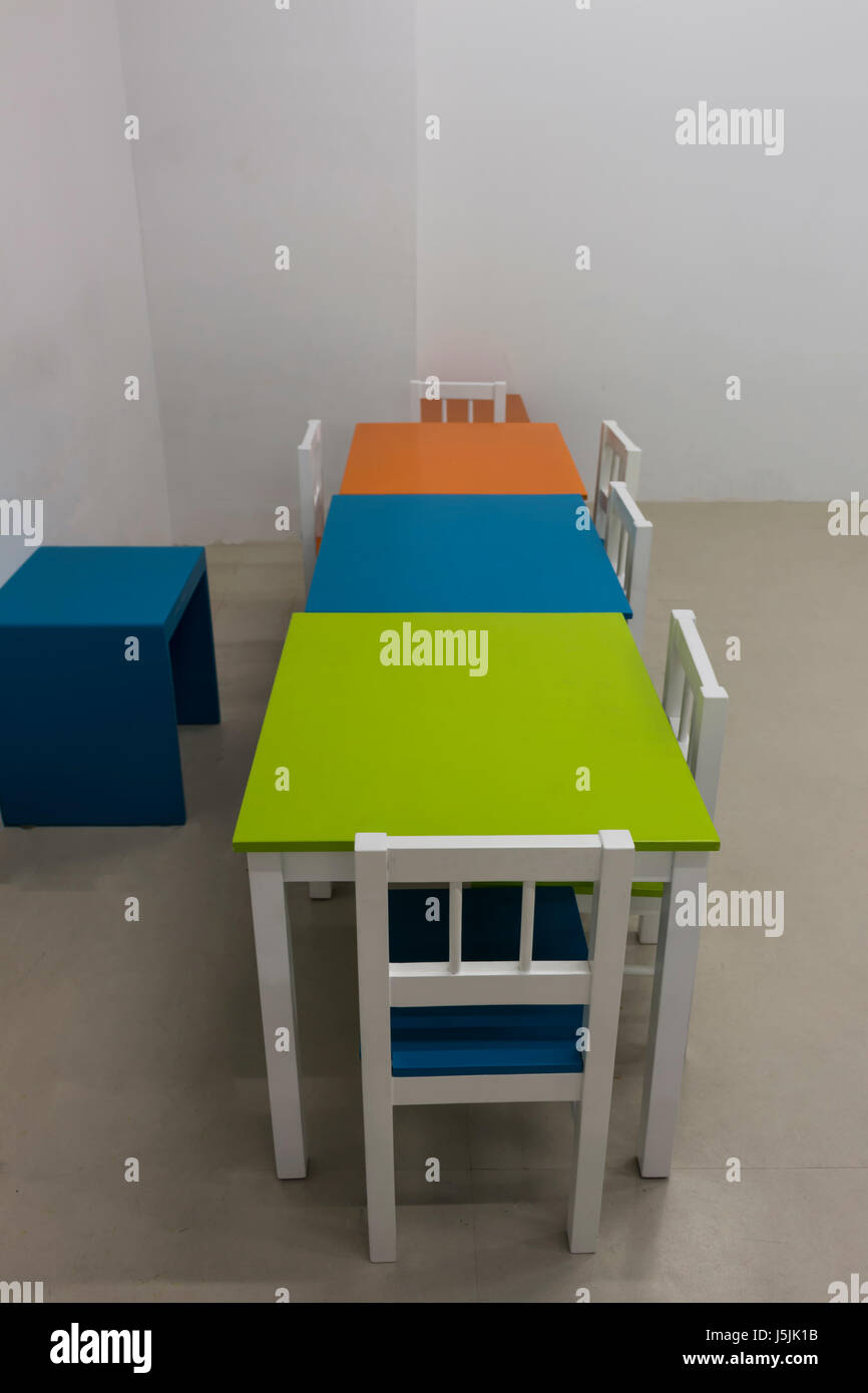 Inside Of The Kindergarten Classroom With Colorful Desks And