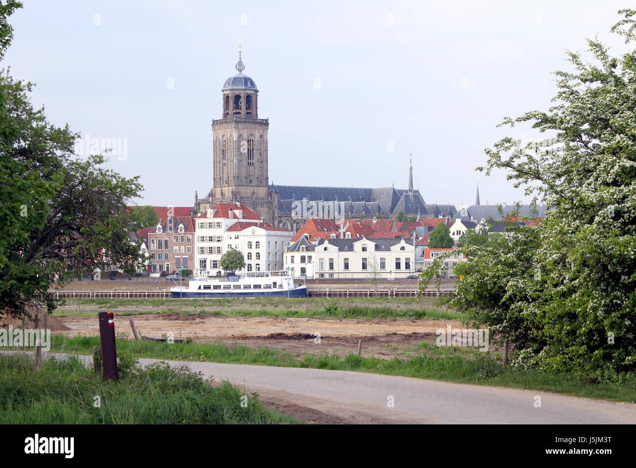 Panorama of the IJssel River at Deventer, Netherlands. City skyline with St. Lebuinus Church (Grote or Lebuïnus Kerk). Stock Photo
