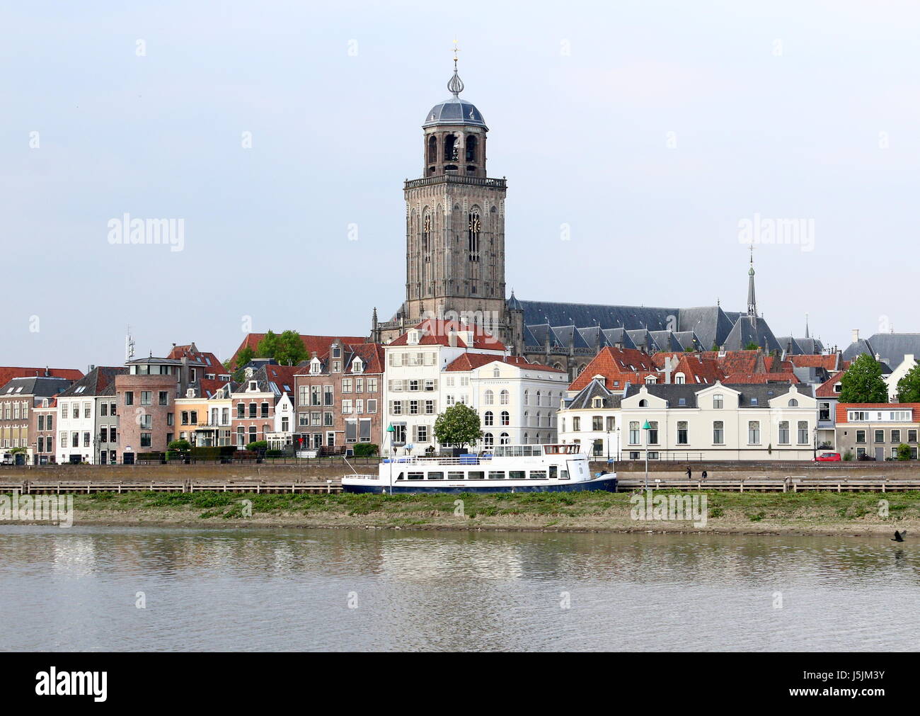 Panorama of the IJssel River at Deventer, Netherlands. City skyline with St. Lebuinus Church (Grote or Lebuïnus Kerk). Stock Photo