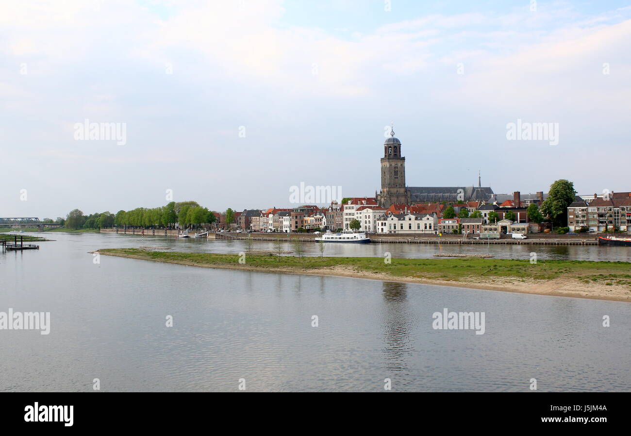 Panorama of IJssel River at Deventer, Netherlands. Skyline with St. Lebuinus Church (Grote Lebuïnus Kerk). River forelands / wash lands in foreground Stock Photo