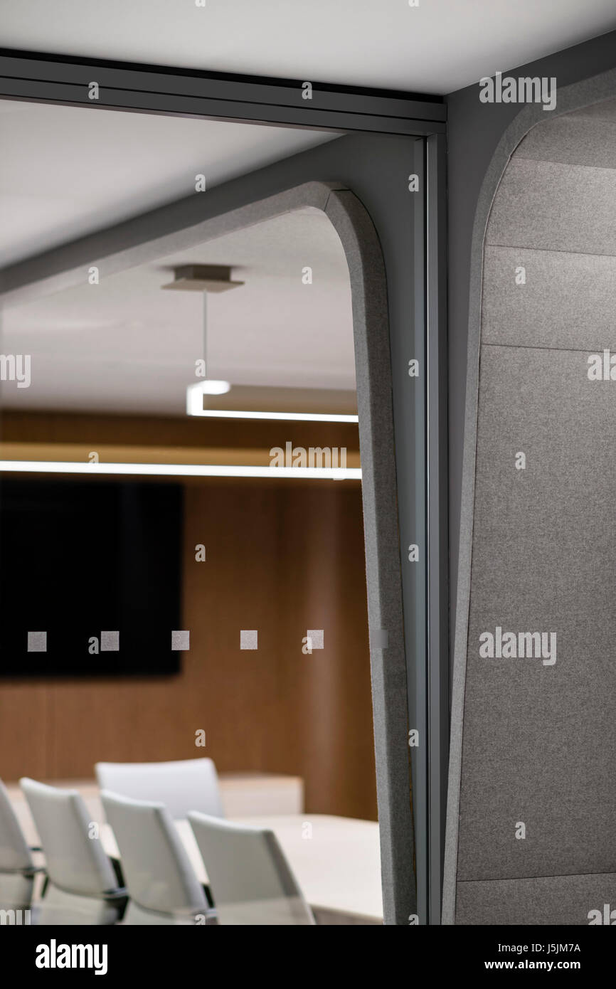 Feltcovered dividing wall and conference room behind etched glass. 280