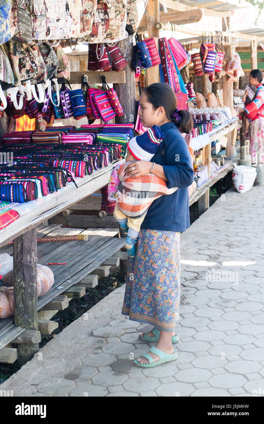 woman vendor with baby in Chiang Mai province, Thailand Stock Photo